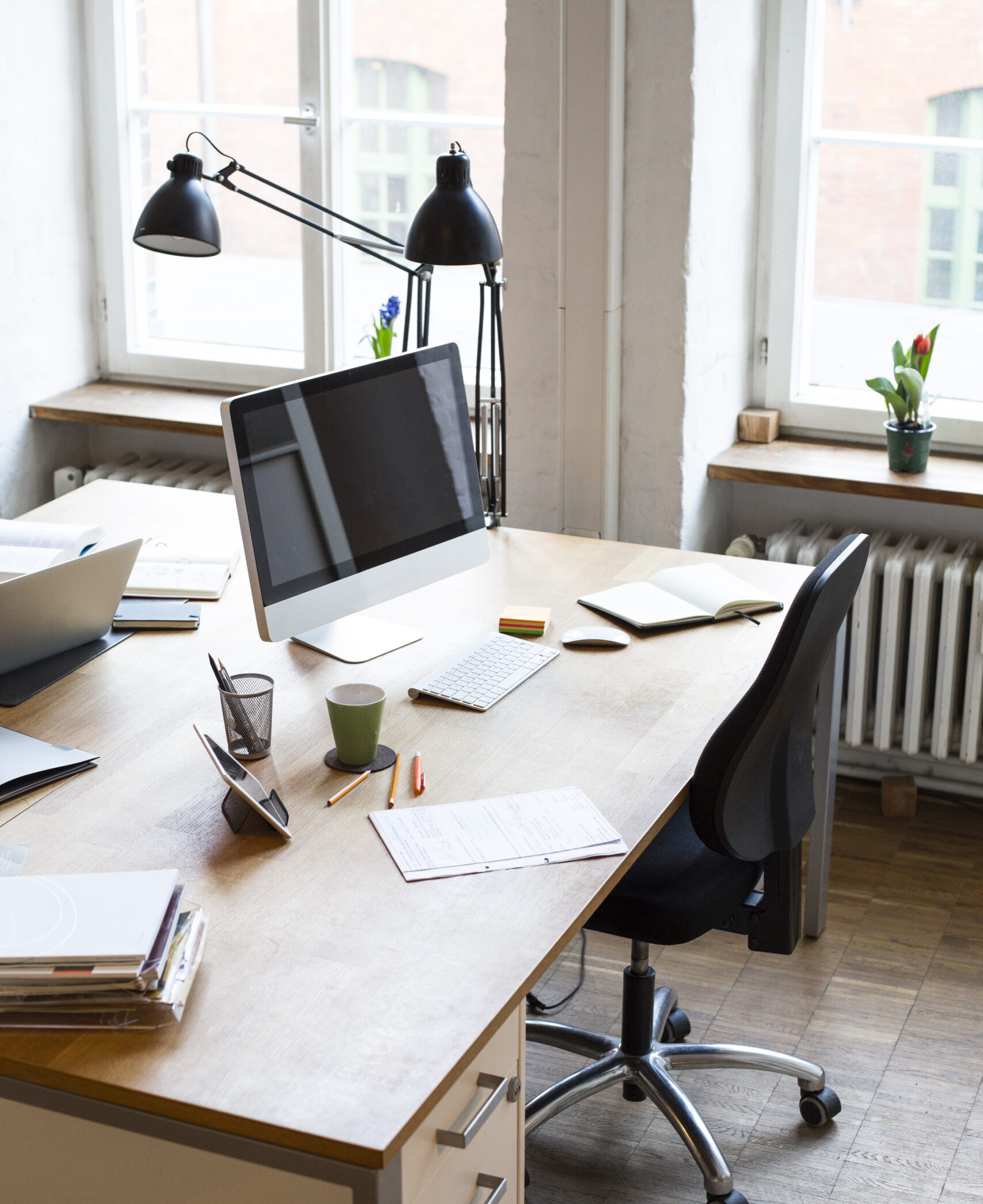 Desk with documents and computer screen